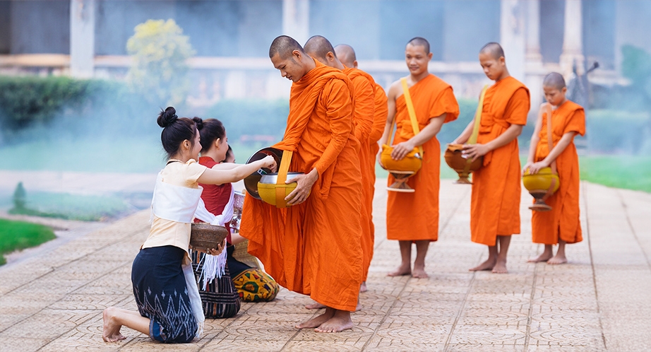 Lao monks goes begging for alms