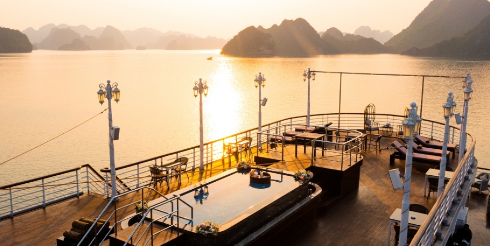 Admire Halong bay's sunset on sundeck 