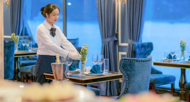 Staff sets up dinning table