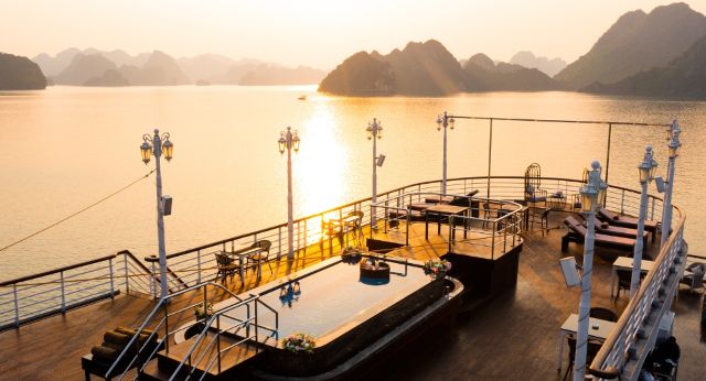 Admire Halong bays sunset on sundeck