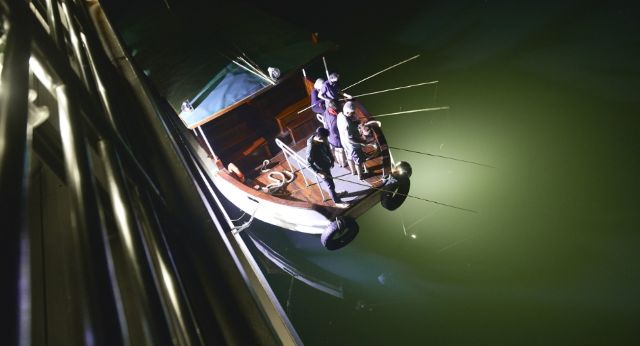 Squid fishing on boat at night