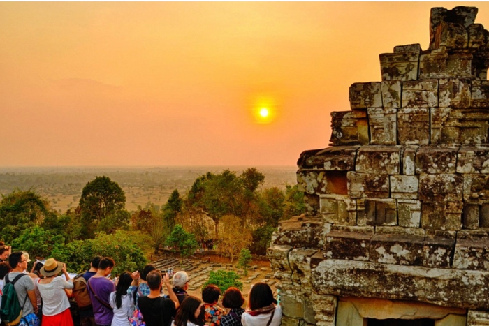 Admire the beauty of Angkor Wat at sunrise