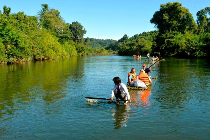 The locals guide a group of trekkers through the forest of Ratanakiri