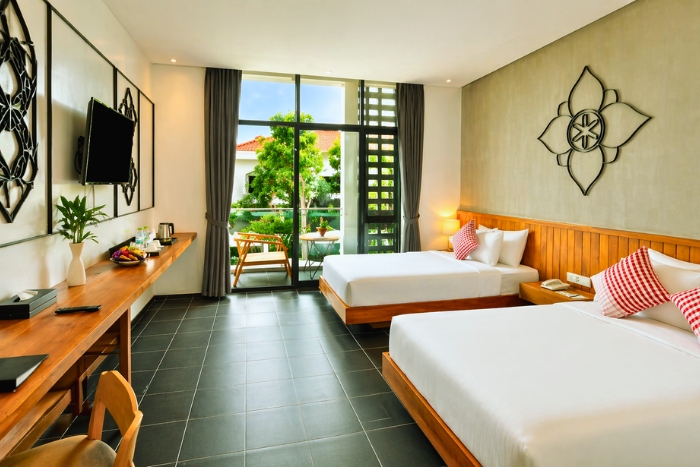 A moment of comfort in a room at Phka Chan Hotel