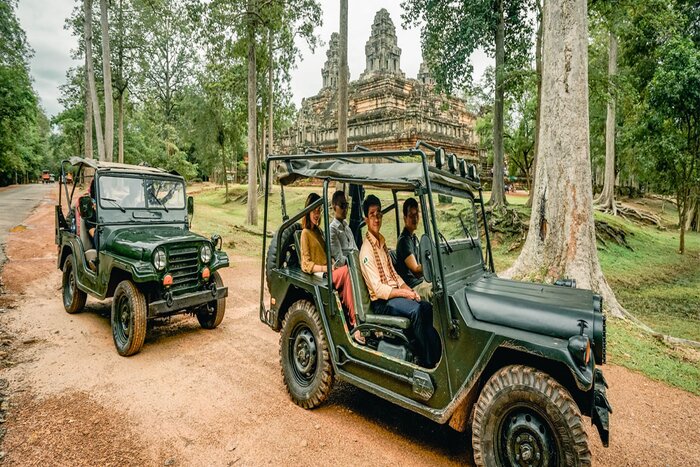 Tourists experience a tuk tuk to the Angkor Complex