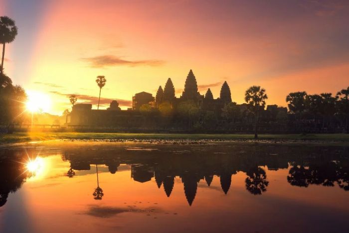Sunrise at Angkor Wat creates an unforgettable pink-orange spectacle