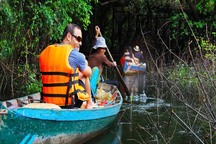 Tourists experience in Mangrove forest on Tonle Sap Lake