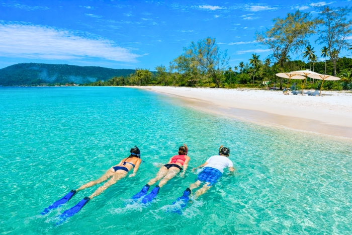 Dive into the crystal-clear waters of Koh Rong during a Cambodia travel offer