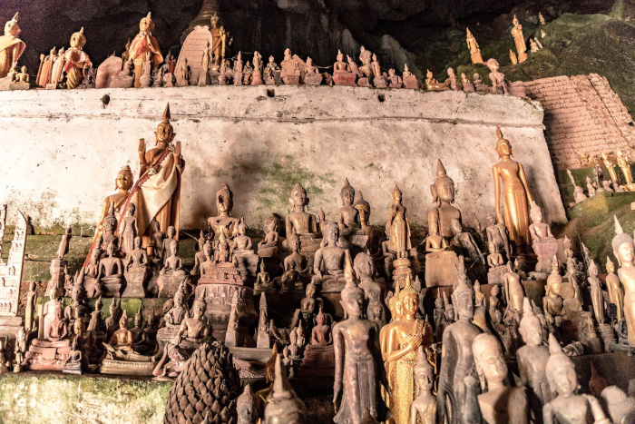 Explore the stunning Pak Ou Caves, a highlight of your Laos itinerary 5 days