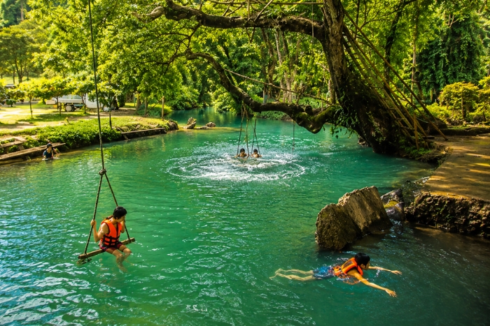 Swimming in the turquoise waters of the Blue Lagoon during my 2-week Laos trip