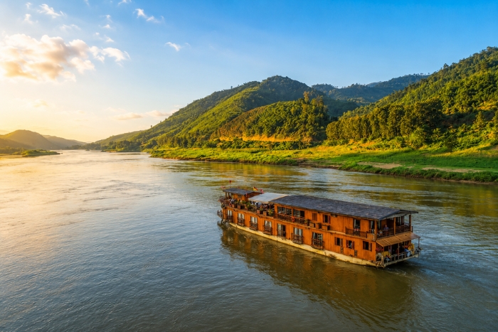 Admire the sunset during a cruise on the Mekong River
