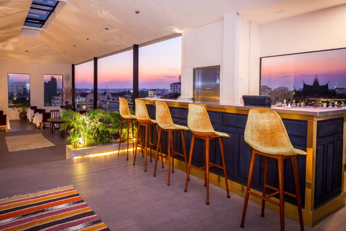 American style restaurant and the bar of Lao Poet Hotel is suitable for a small MICE travel in Laos