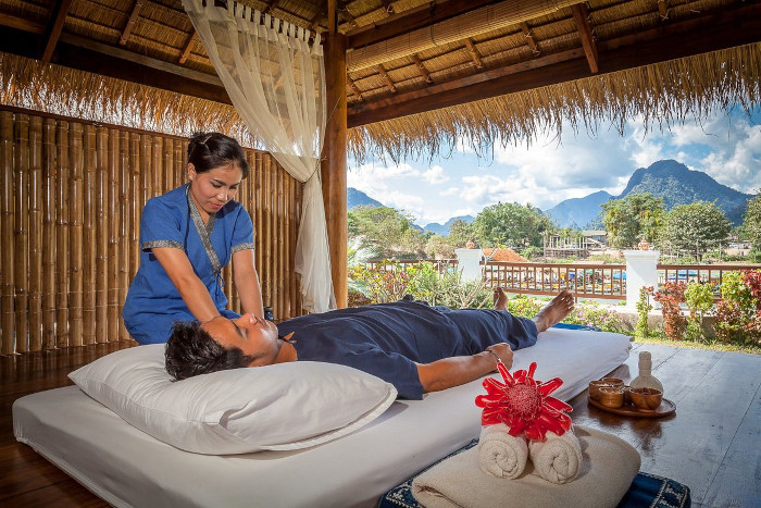 Unwind with a soothing treatment at Riverside Sala Spa while enjoying the rain in Laos.