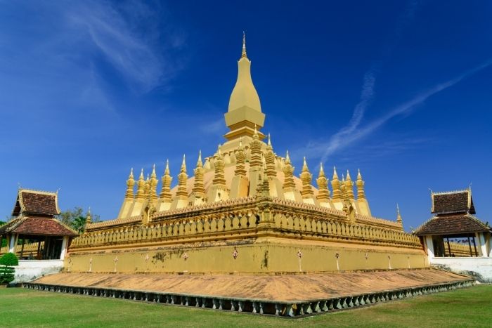 Visit the Pha That Luang monument during a family trip to Laos