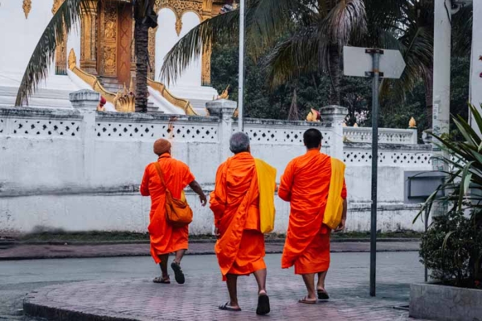 Respecting local customs at a temple in Laos