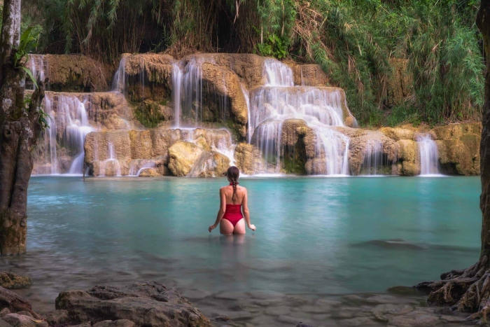 Solo female travel in Laos: Magical moment at Kuang Si Falls during the 21-day adventure