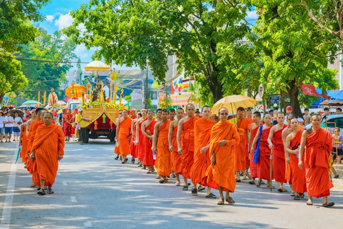 The spiritual atmosphere during the Buddha procession in Laos