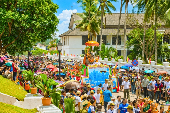 Experience the Buddha procession during the festivals in Laos in April