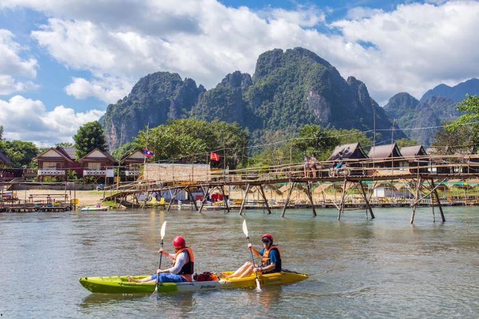 What to do in Laos in May? Kayaking on the Nam Song River