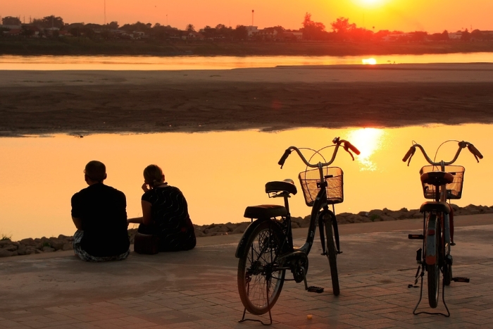 Bike ride along the Mekong in your girlie weekend in Vientiane
