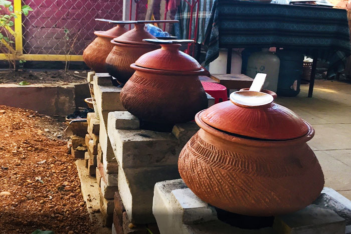 Using the charcoal stove to cook