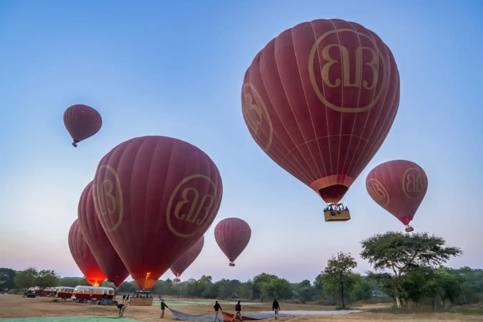 Hot air balloons take tourists into the air to admire the panoramic view of Bagan