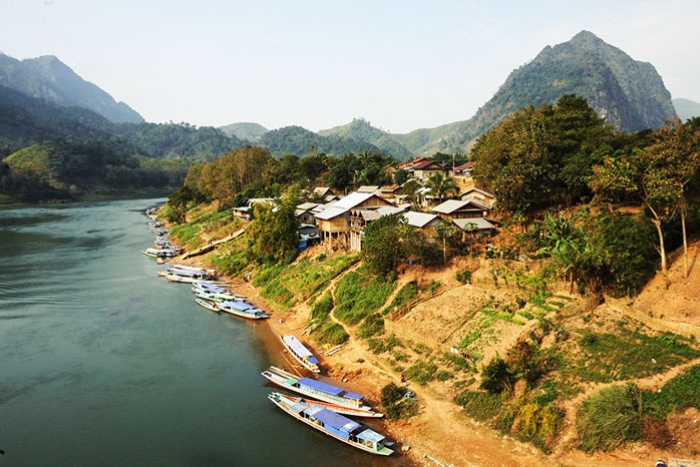 Waking up in Muang Ngoi — birdsong, mountain mists, and serenity all around