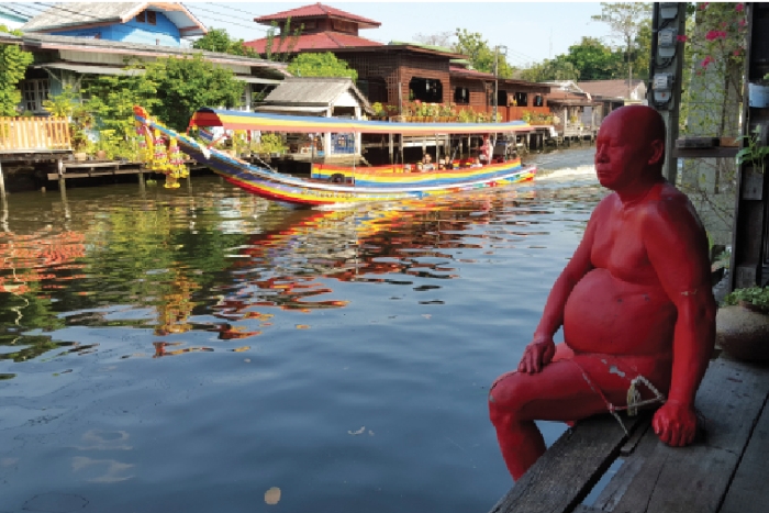 Life-size statue, painted red at the Artist House Bangkok