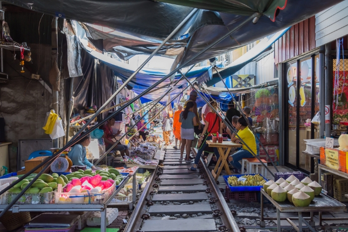 Explore Maeklong Railway Market during your affordable Thailand family vacation