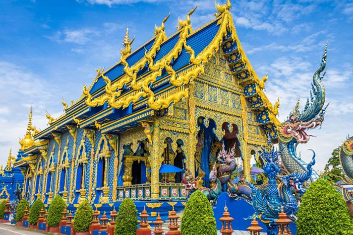 Main temple hall (ubosot) of the blue temple in Chiang Rai