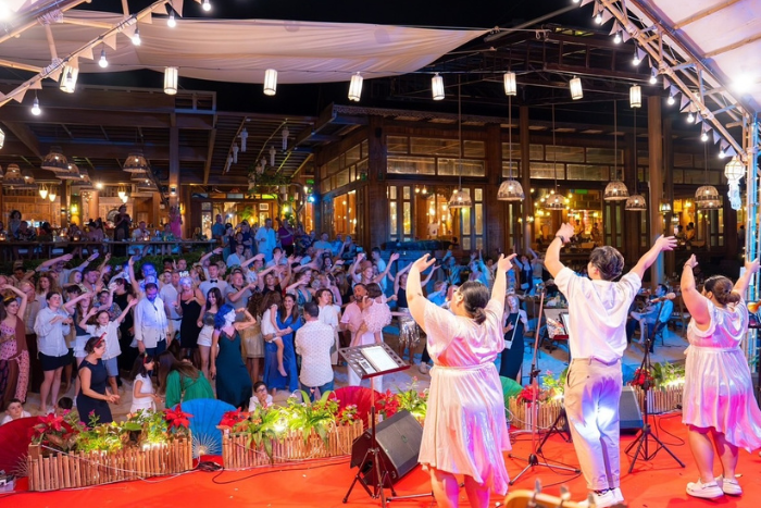 Tourists enjoy the party, dancing and singing together on New Year's Eve in Koh Yao Yai