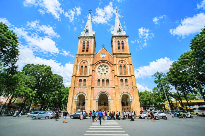 Admiring the colonial architecture of the Notre-Dame Cathedral of Saigon in a 10-day Southeast Asia itinerary