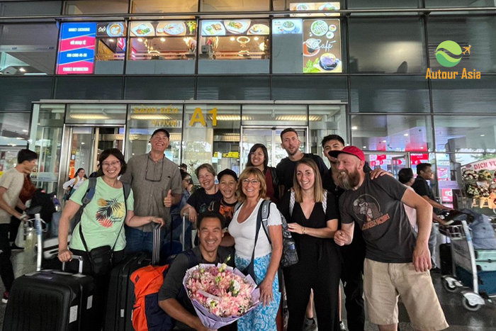 Our guide welcomes travelers at the airport