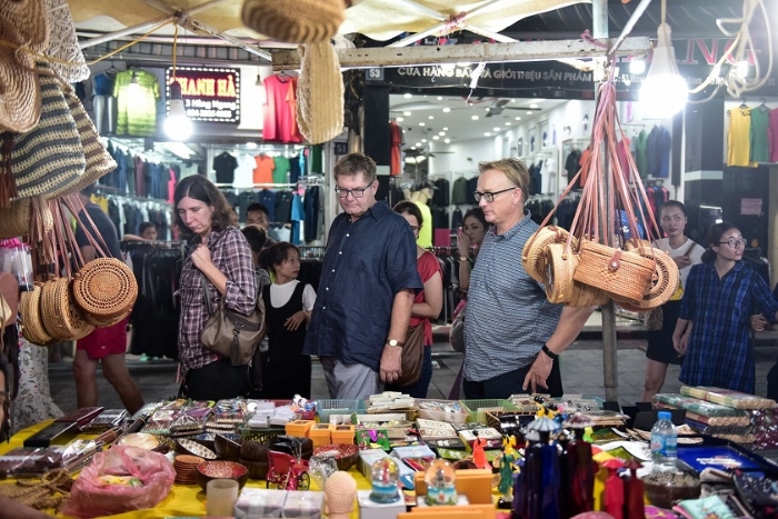 Strolling through the bustling streets of Hanoi and shopping for souvenirs