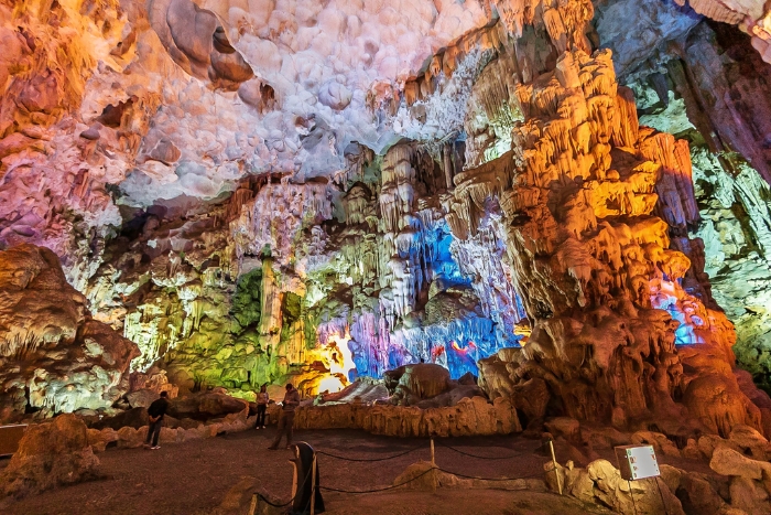 Colorful rock formations inside massive Sung Sot Cave chambers