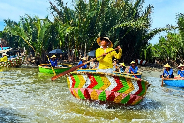 Riding a basket boat through Bay Mau coconut forest