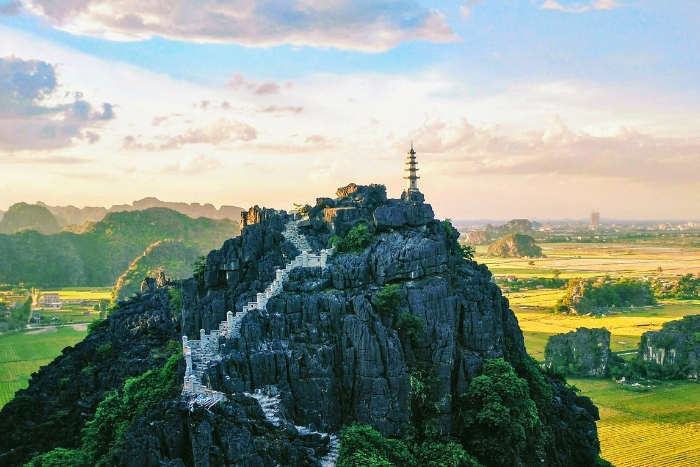 Admiring the panoramic view from Mua Cave viewpoint