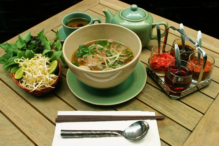 Enjoying a warm bowl of Vietnamese pho