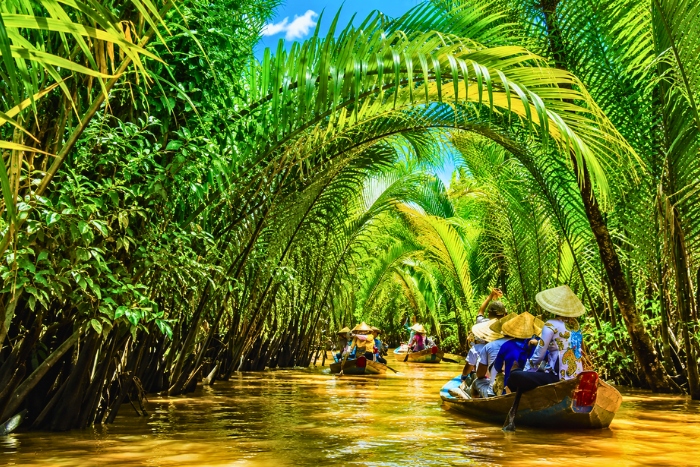 Drifting along the canals of the Mekong Delta by sampan