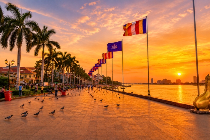 Admiring the sunset over Sisowath Quay on a luxury Vietnam Cambodia tour