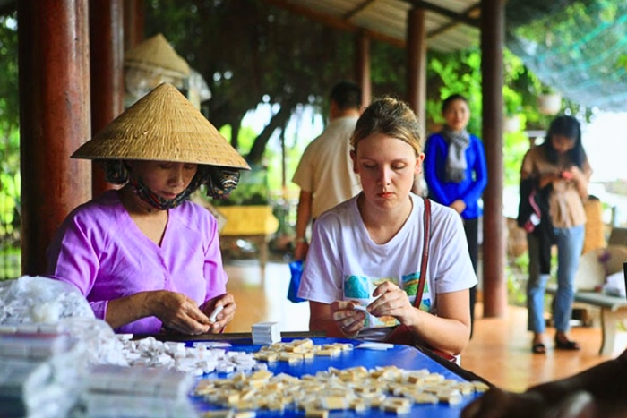 Traditional candy making process at a Ben Tre workshop