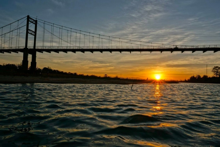 The Kon Klor suspension bridge crosses the majestic Dakbla River