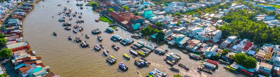 Traveling to Can Tho means stepping into a world where canals replace roads and life flows with the river