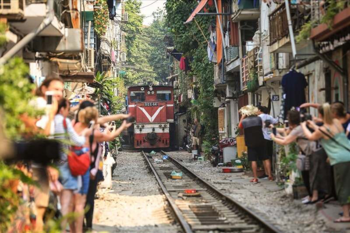 Don't miss having a coffee while watching the train passing by at Train Street during your 3 days trip to Hanoi!