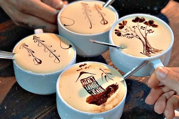 Enjoying an egg coffee at Café Dinh