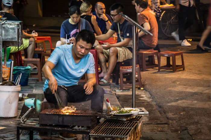 Freshly cooked food on the street of Hanoi old quarter.