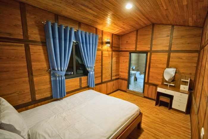 Simple and welcoming interior of a room at Homestay A Lủ