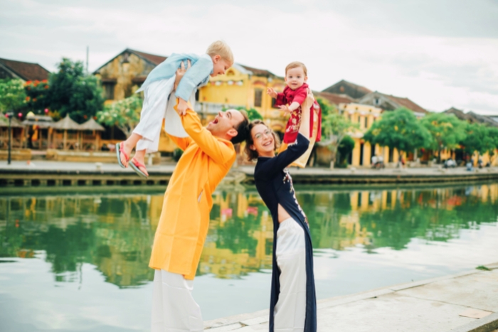 Wearing traditional Ao Dai for a Vietnam family itinerary