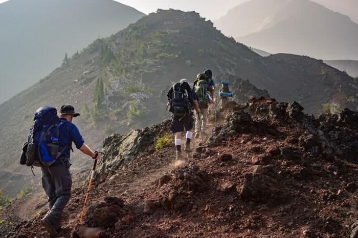 Trekking to the summit of Mount Phia Oac through mountain forests