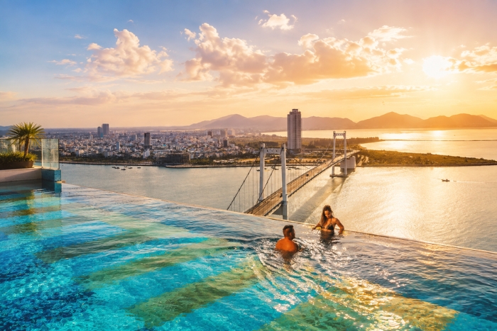 Enjoy an exceptional moment in the infinity pool at Wyndham Danang Golden Bay Hotel